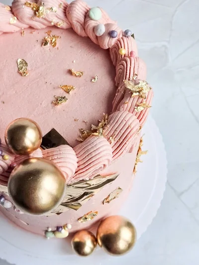 Celebratory graduation cake with academic theme in Cambridgeshire