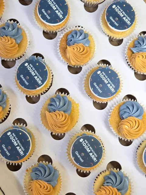Blue and gold Gearset branded cupcakes prepared for a Cambridge corporate event
