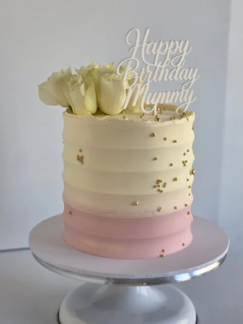 Pink ombre birthday cake for Mummy with white roses and gold sprinkles