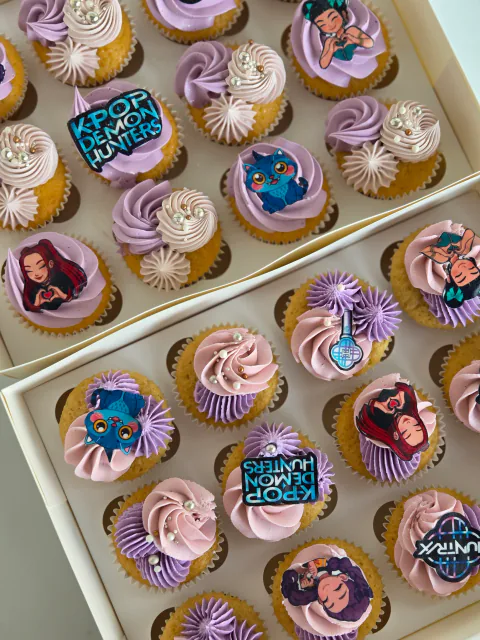 K-pop Demon Hunters themed cupcakes with character and logo toppers