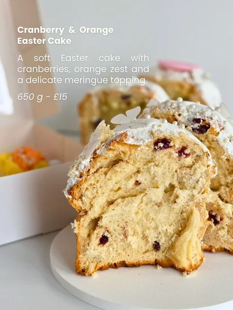 Cranberry and orange Easter Paska sliced open to show the soft crumb and dried fruit