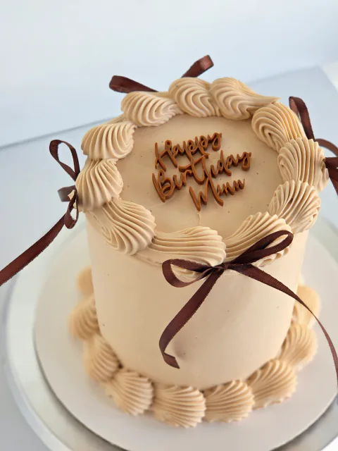 Mini bento cake with chocolate vintage piping, ribbon bows and Happy Birthday Mum message