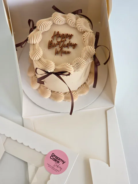 Happy Birthday Mum mini bento cake with chocolate bows in a clear gift box