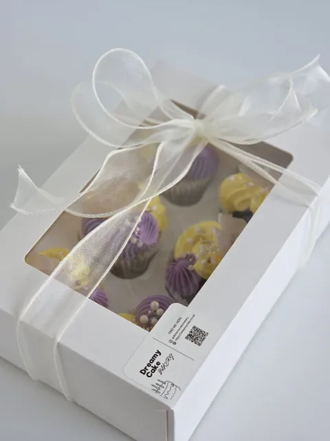 Mother’s Day cupcake gift box wrapped with a white ribbon