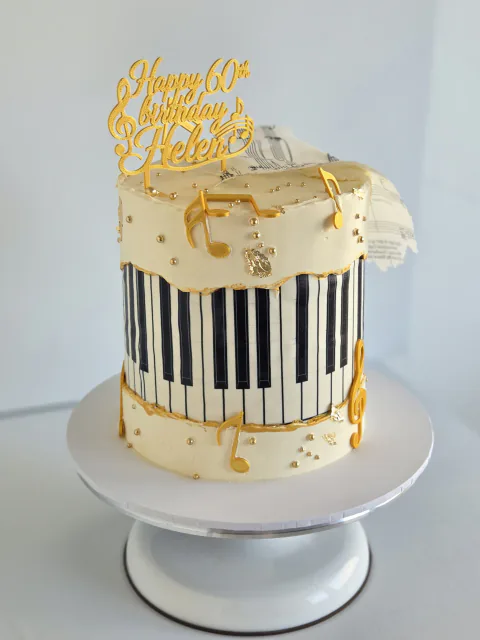 Piano and music-themed sixtieth birthday cake personalised for Chelsea