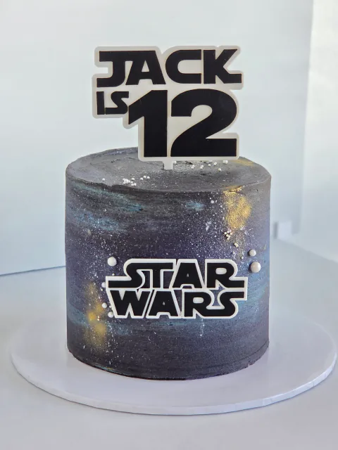 Star Wars galaxy birthday cake with spaceship details and Jack is 12 message