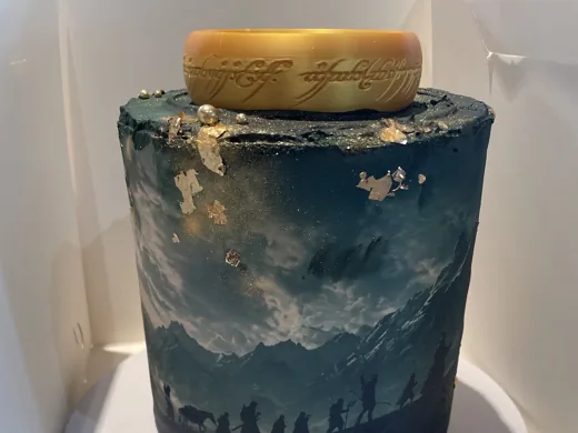 Blue celebration cake photographed by the customer