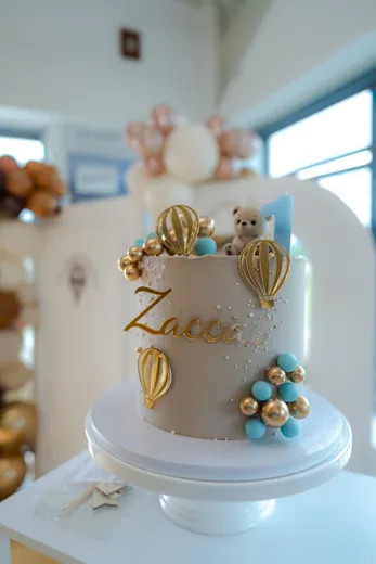 Celebration cake with balloon details photographed by the customer